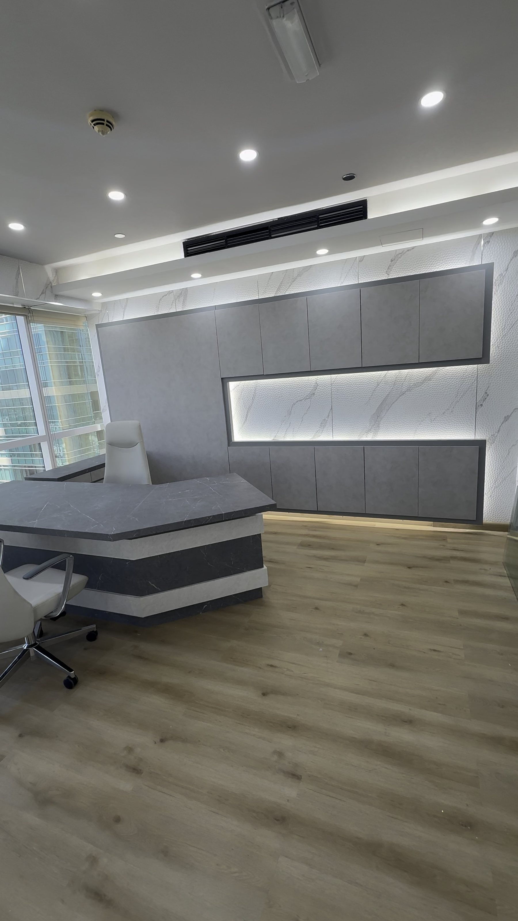 Vinyl-wrapped executive desk and wall panelling, Dubai office fit-out